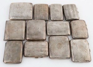 Twelve assorted sterling silver cigarette cases, early 20th century, the largest 9.5cm wide, 818 grams total