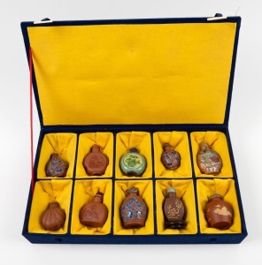 Ten assorted Chinese snuff bottles, housed in a fitted blue and yellow cloth covered box, the box 35cm wide