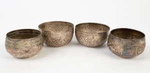 Four assorted Eastern silver finished bowls, 20th century, the largest 12cm diameter