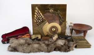 Brutalist wall plaque, silver plated candlesticks, sighting equipment, miniature silk portrait, Fijian kava bowl, fox fur stole, playing cards, green stone pendant, miniature violin in case, "Dear Old London" vintage booklets and assorted watercolours