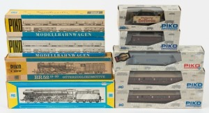 PIKO: two HO scale steam locomotives with tenders: BR52 19-20 & BR01.5 plus 7 various passenger and freight cars. All in makers' boxes. (9 items).