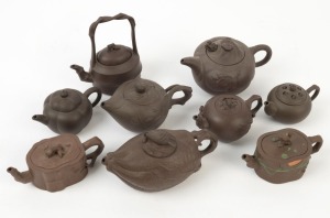 Xizheng ware group of nine assorted Chinese pottery teapots, the largest 14cm high