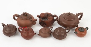 Xizheng ware group of eight assorted Chinese pottery teapots, the largest 11cm high
