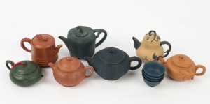 Xizheng ware group of seven assorted Chinese pottery teapots, together with 4 blue cups, (11 items) the largest 11cm high