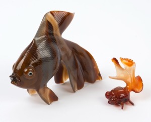 Two Chinese carved agate fish ornaments, 20th century, the larger10cm high