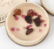 NATURAL RUBIES, group of 16 specimens, housed in circular card box with label and note "S. HENSON, 277, STRAND, LONDON, MINERALOGIST, Spinel Ruby, Ceylon", 19th century - 2