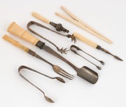 Antique silver and bone baby whistle, antique stilton scoop, pickle fork, glove stretcher, manicure tool, and three silver plated sugar nips, 19th and 20th century, the scoop 24cm long