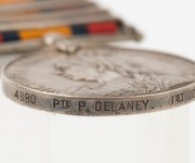 The QUEEN'S SOUTH AFRICA MEDAL with clasps for CAPE COLONY, ORANGE FREE STATE, TRANSVAAL, and SOUTH AFRICA 1902; named to 4880 PTE. P. DELANEY. 1ST CONNAUGHT RANG: - 3