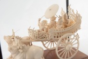 A Burmese carved ivory wagon sculpture, housed in timber and glass case, mid 20th century, the case 30cm high overall - 2