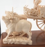 A Burmese carved ivory wagon sculpture, housed in timber and glass case, mid 20th century, the case 30cm high overall - 3