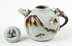 A Chinese porcelain teapot with bear spout and floral handle, Qing Dynasty, late 19th century, 11.5cm high