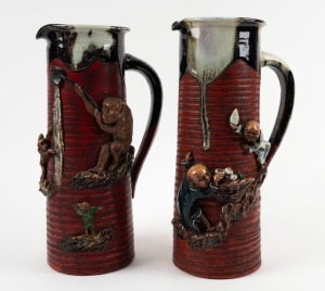 SUMIDA GAWA pair of Japanese pottery jugs adorned with monkeys and figures, 32cm high