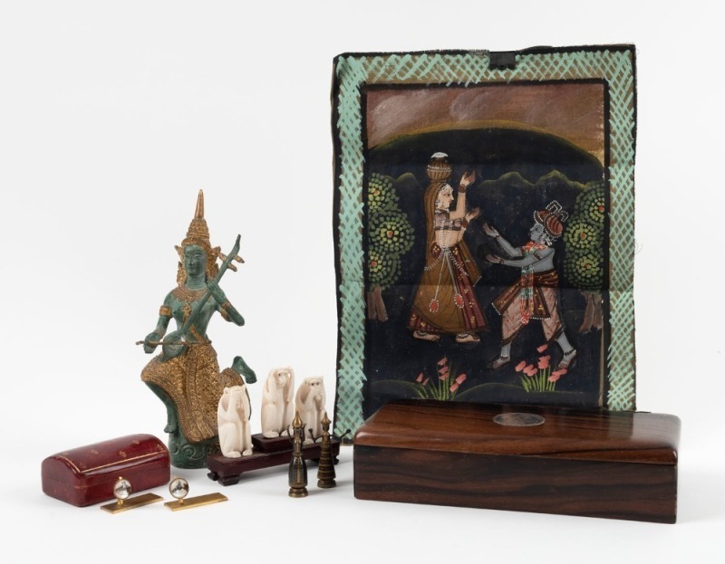 A Thai cast bronze musician statue, an Indian painting on cotton cloth, A Chinese carved ivory monkey group, antique ebony box with 1908 silver peso coin set into the lid, Italian leather jewellery box, pair of equine place-name holders, and pair of metal