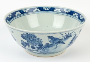 A Chinese blue and white porcelain bowl with birds and floral decoration, Qing Dynasty, 19th/20th century, 13cm high, 29cm diameter