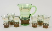 A vintage lemonade set, green glass with gilt highlights, comprising a jug and six glasses, (7 items), ​​​​​​​the jug 21cm high 