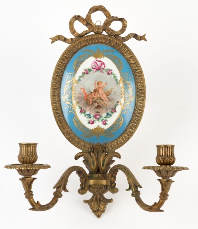 An antique French porcelain two branch wall sconce with gilt metal surround, 19th century, 36cm high