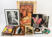 An accumulation of movie stills, publicity photos, collector items and theatrical programmes with several items framed including a reproduction Casablanca poster. The collector obviously had a "thing" for Marilyn Monroe, Paul Newman, Humphry Bogart and ot