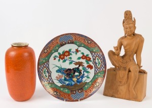 A Chinese porcelain charger, carved timber statue, and an orange glazed vase, 20th century, (3 items), the statue 49cm high