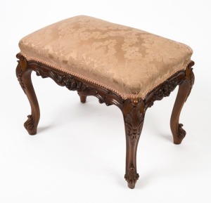 An antique English carved walnut boudoir stool, 19th century, 51cm high, 65cm wide, 45cm deep.