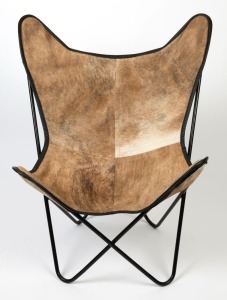 A reproduction sling chair, black metal with cow hide covering, 100cm high, 83cm wide, 71cm deep.