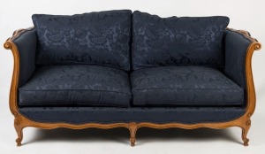 A four seater sofa in the French antique style, patinated beech frame and royal blue fabric with scroll arms and cabriole legs, 79cm high, 184cm wide, 92cm deep