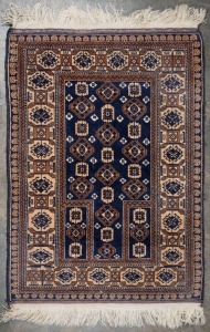 A hand-knotted navy blue and brown prayer rug,  145 x 96cm. 