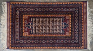 Two hand-knotted Persian rugs on blue grounds with orange and red highlights, the larger 150 x 85cm.