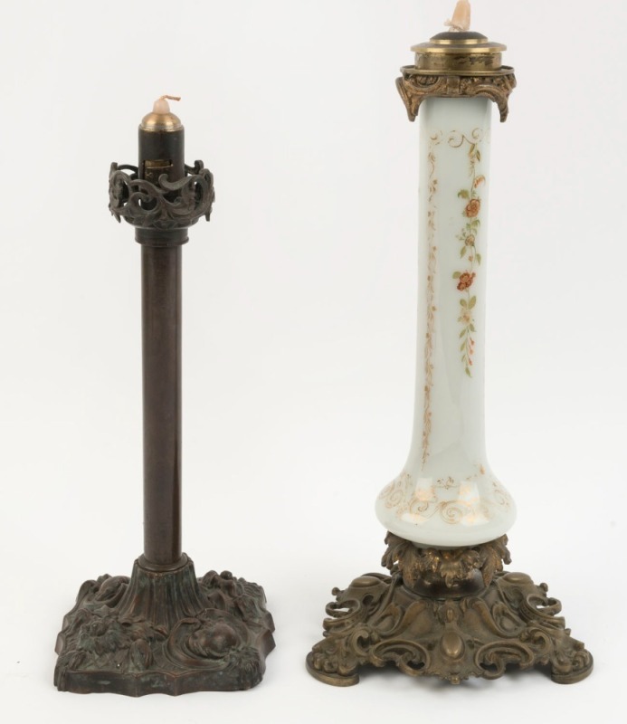 Two candle holders with spring loaded mechanisms, 42cm and 37cm high