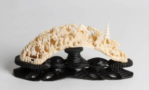 A Chinese finely carved tusk, 20th century, 20cm high