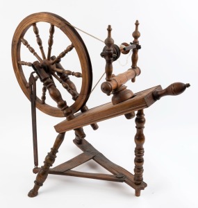 An antique spinning wheel, turned and carved beech, 19th century, ​​​​​​​70cm high