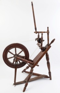 An antique spinning wheel, elm and stained beech with penwork and hand-painted decoration, 19th century, ​​​​​​​117cm high