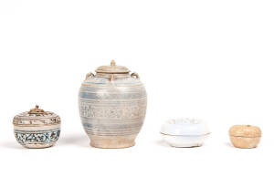 A Chinese small box and cover, Song Dynasty 960-1279; together with a Chinese white glaze box and cover, a Thai Sawankhalok box and cover and luged ovoid jar. 6.3cm diameter, 10.2cm diameter, 9.6cm diameter and 17cm high.