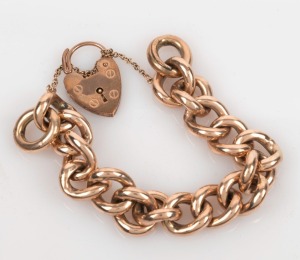 An antique copper-filled 9ct gold curb-link bracelet with 15ct gold heart lock (with extra link), late 19th century