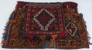 Three assorted Persian hand-knotted wool cushion covers, the largest 110 x 50cm