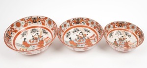 KUTANI ware graduated set of three Japanese porcelain bowls, Meiji period, 19th century, the largest 8cm high, 24cm diameter