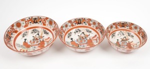 KUTANI ware graduated set of three Japanese porcelain bowls, Meiji period, 19th century, the largest 8cm high, 24cm diameter