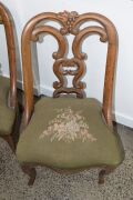 A set of four antique carved walnut salon chairs with French cabriole legs and green floral tapestry upholstery, mid 19th century, 82cm high - 2
