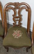 A set of four antique carved walnut salon chairs with French cabriole legs and green floral tapestry upholstery, mid 19th century, 82cm high - 4