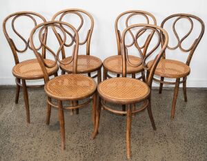 A set of six antique bentwood dining chairs. Note: Some re-caned and some bearing original label "J. & J. Kohn. Austria"