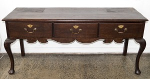 An antique oak Welsh dresser base with cabriole legs and pad feet, 19th century, 76cm high, 170cm wide, 55cm deep
