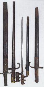 BAYONETS, group of five antique and vintage examples, four with scabbards, including British socket, French and Turkish, 19th/20th century, ​​​​​​​the largest 68cm overall
