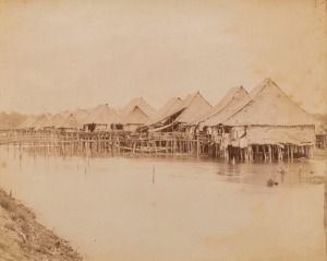 GUSTAVE RICHARD&nbsp;LAMBERT (Singapore River hut dwellings), albumen paper print, circa 1880s, photographer&rsquo;s blind stamp on image lower right, 21.5 x 27.5cm, laid down on card.