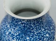 A Chinese ornate blue and white porcelain vase, adorned with vignettes of water scenes, landscapes, birds and blossoms, Guan Xu mark to base, 19th/20th century, 35cm high - 19