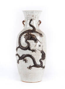 A large crackled glazed Chinese floor vase, decorated with a biscuit dragon and a phoenix, late Qing Dynasty, circa 1900, 56cm high