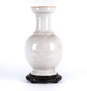 A Chinese crackled glazed baluster vase, 20th century, fitted wood stand, 42cm high