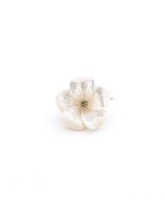 BROOCH: Mother of pearl and diamond flower brooch.