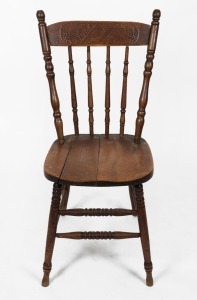 An antique Australian blackwood and kauri pine kangaroo back dining chair