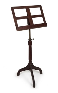 A antique Australian cedar music stand with crab legs and adjustable column, 114cm high, adjusts to 140cm high