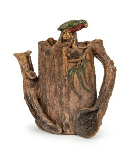 WILLIAM RICKETTS rare Australian pottery tree trunk teapot, adorned with gumnuts, leaves and king parrot finial glazed with green and red, incised "Wm. Ricketts, Melbourne, 1934". This piece was one of a series of teapots Ricketts made for the Melbourne Centenary Exhibition. 19.5cm high