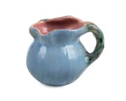 PHILIPPA JAMES pottery jug with applied gumnuts and leaf with branch handle, glazed in blue and green with pink interior and highlights, incised "Philippa James", 8cm high, 10cm wide - 2